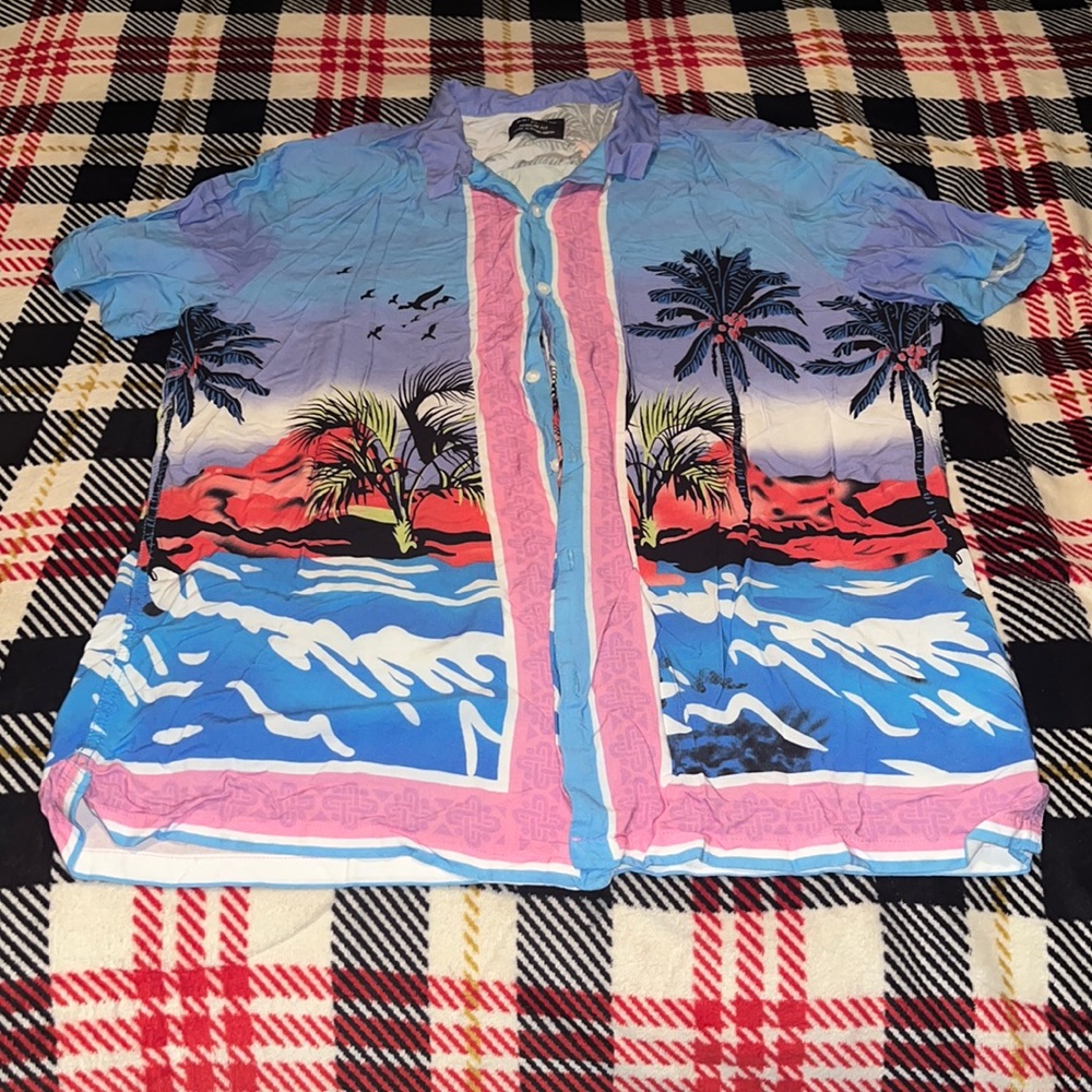 A pink blue purple yellow red white and black button down shirt